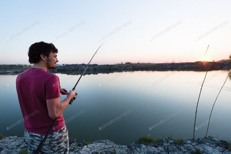 files/Young_man_fishing_at_pond_and_enjoying_hobby.jpg